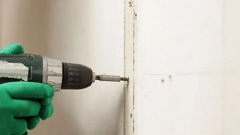 Screw a screw from the wall Stock Footage 129137788
