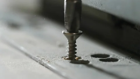 The screw is screwed into the board Stock Footage 162167719