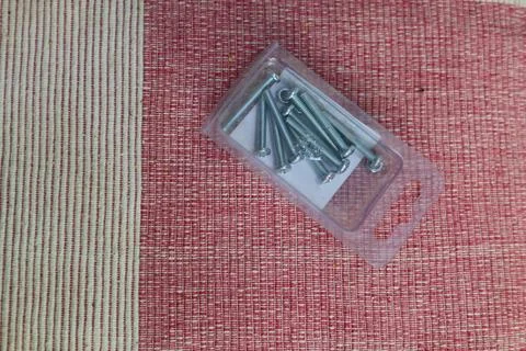 Screw set in the transparent plastic box Foto stock