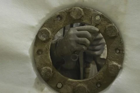 Screw the stud and nut with your hand when attaching the flange to the wall.. Stock Photos
