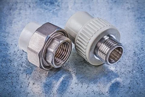 Screw-thread pipe connectors on metallic background construction concept Stock Photos