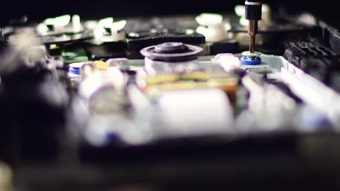 Screw triver dvd drive, selective focus Stock Footage 257939528