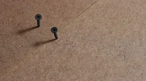 Screw twists on the floor top view Stock Footage 40351462
