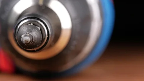 The screw is wearing a bit of electric screwdriver. Macro photography moving Stock Footage