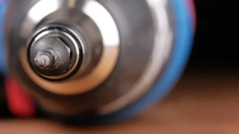 The screw is wearing a bit of electric screwdriver. Macro photography moving Stock Footage 73396239