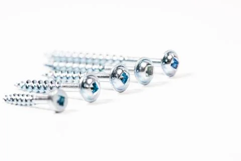 Screw on white background. Macro carpentry tool Photos