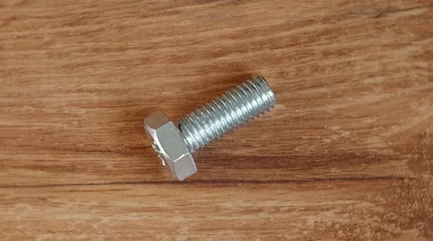 Screw on wooden table Stock Footage 42790521