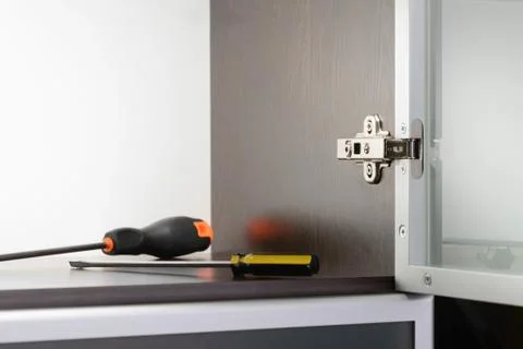 Screwdriver and Concealed Hinge 스톡 사진