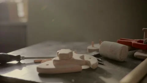 Screwdriver and elements of furniture on the table in the carpentry shop, close- Stock Footage 219347196