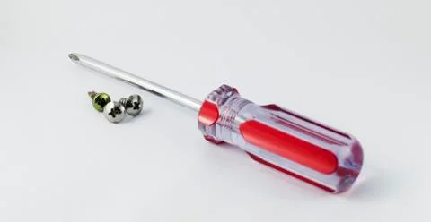Screwdriver and nut isolated 스톡 사진