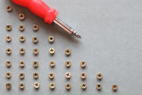 Screwdriver and screws Stock Photos