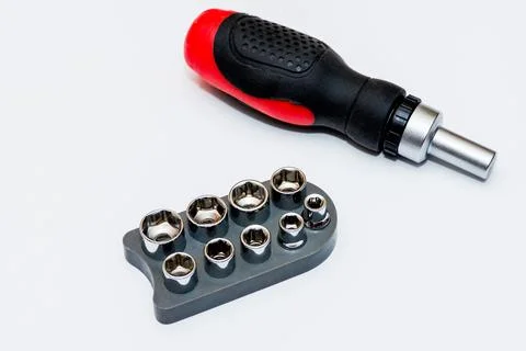 Screwdriver and set bits on white background, isolate Stock Photos
