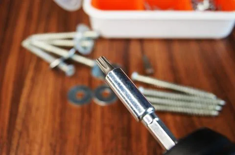Screwdriver bit and adapter, close-up. Construction and assembly. Stock Photos