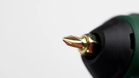 Screwdriver bit spinning with chuck of green drill Stock Footage 345416350