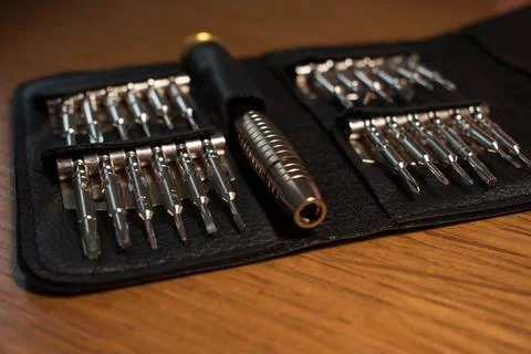 Screwdriver bits made from tool steel in a black leather case Stock Photos