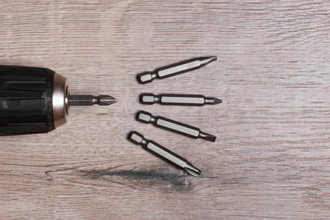 Screwdriver with bits of nozzles for twisting Stock Photos