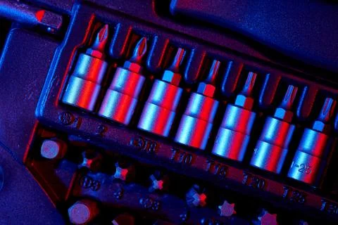 Screwdriver bits in the repair tool kit. Mixed lighting Stock Photos