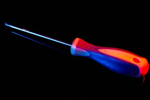 Screwdriver on black background with reflection. Mixed lighting Foto stock