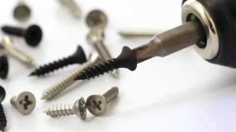 Screwdriver with a black screw head, rotating at high speed Vídeo Stock 322927363
