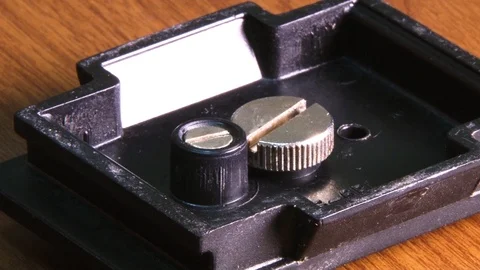 Screwdriver bolt on tripod. Tighten the bolt Stock Footage 101679701