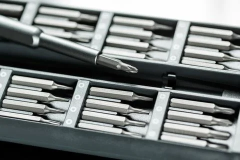 Screwdriver with chanchable metal bits and adapters. Stock Photos