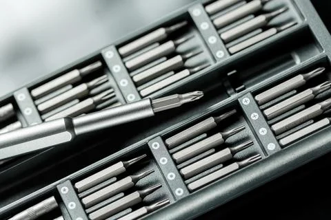 Screwdriver with chanchable metal bits and adapters. Stock Photos