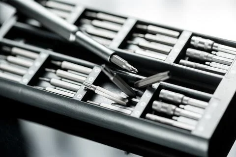 Screwdriver with chanchable metal bits and adapters. Stock Photos