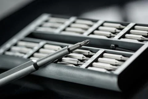 Screwdriver with chanchable metal bits and adapters. Stock Photos