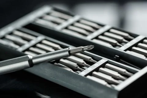 Screwdriver with chanchable metal bits and adapters. Stock Photos