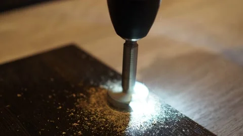 A screwdriver with a drill for the hinge holes. drill the door. making a kitchen Stock Footage 146304626