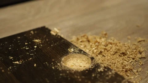 A screwdriver with a drill for the hinge holes. drilling a hole in the furniture Stock Footage 154954851