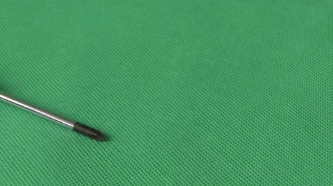 Screwdriver on green background Stock Footage 59124285