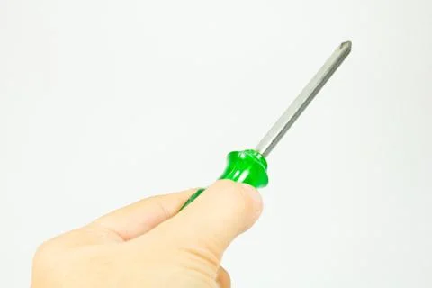 Screwdriver in hand  on white background. Stock Photos