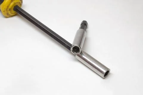 Screwdriver head for interchangeable bits, and hex shank extension bar. chr.. Stock Photos