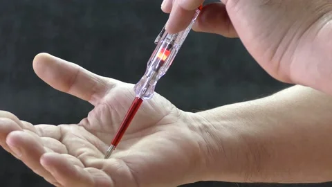 Screwdriver with indicator for determining the electrical phase. Stock Footage 149564359