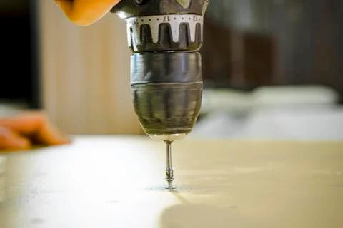 A screwdriver inserted into the screw head. Stock Photos