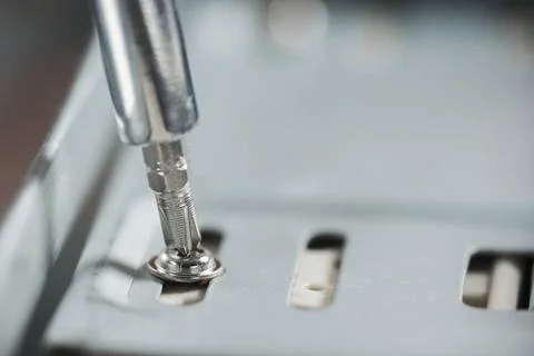 Screwdriver inserted screw screwdriver inserted screw. High resolution pho... Foto stock