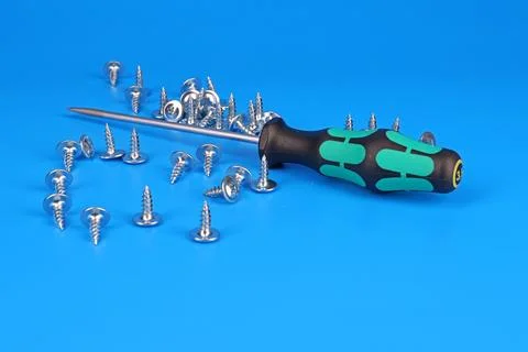 Screwdriver with an insulated handle for installing equipment. Photos