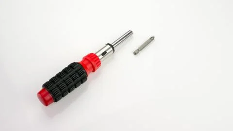 Screwdriver with interchangeable nozzles.On white background. Stock Photos