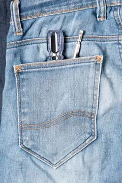 Screwdriver in jean Stock Photos