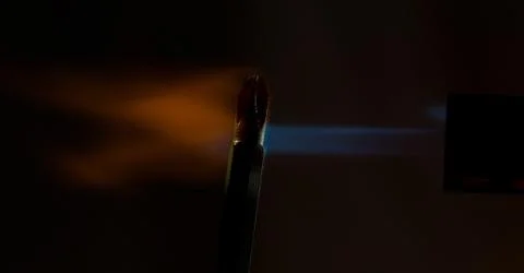 Screwdriver lit under a stream of fire Stock Photos