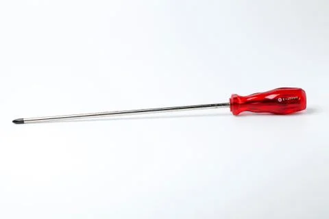 Screwdriver with red grasp Stock Photos