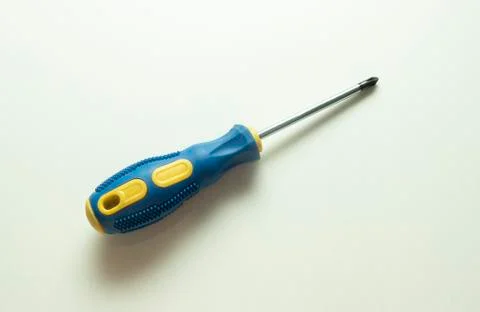 Screwdriver. Screwdriver on a white background. Screwdriver with blue and yel Stock Photos
