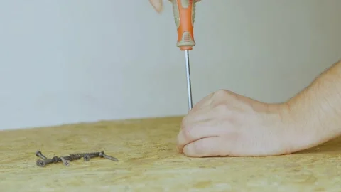 Screwdriver screwing a of screw Into The oriented strand board. Close up Stock Footage 200966662
