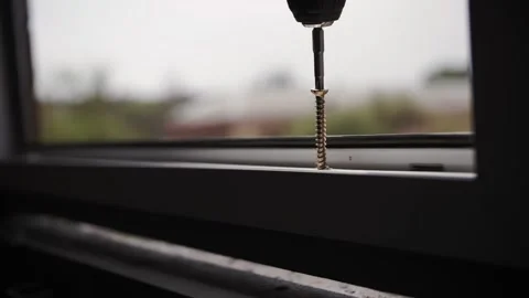 Screwdriver screws screw, installation of window frame Stock Footage 192471330