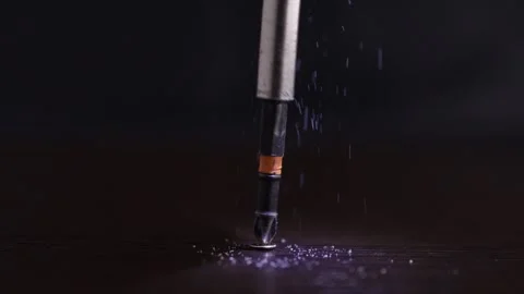 Screwdriver Securing Screw in Wood Stock Footage 259564395