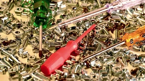 Screwdriver with server rack screws on a turntable Stock Footage 147746797