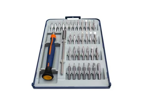 Screwdriver with a set of bits on a white background. Stock Photos