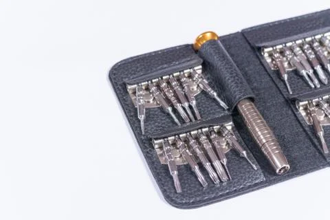 Screwdriver set in the black leather package Stock Photos