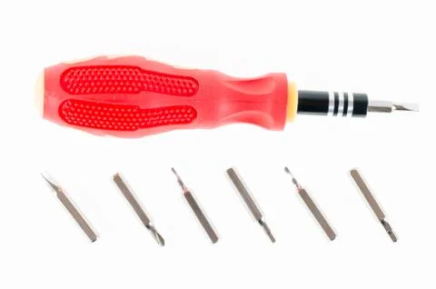 A screwdriver with a set of changable nozzels isolate on white background Foto stock